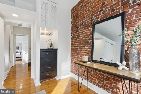 a view of a hallway with a living room