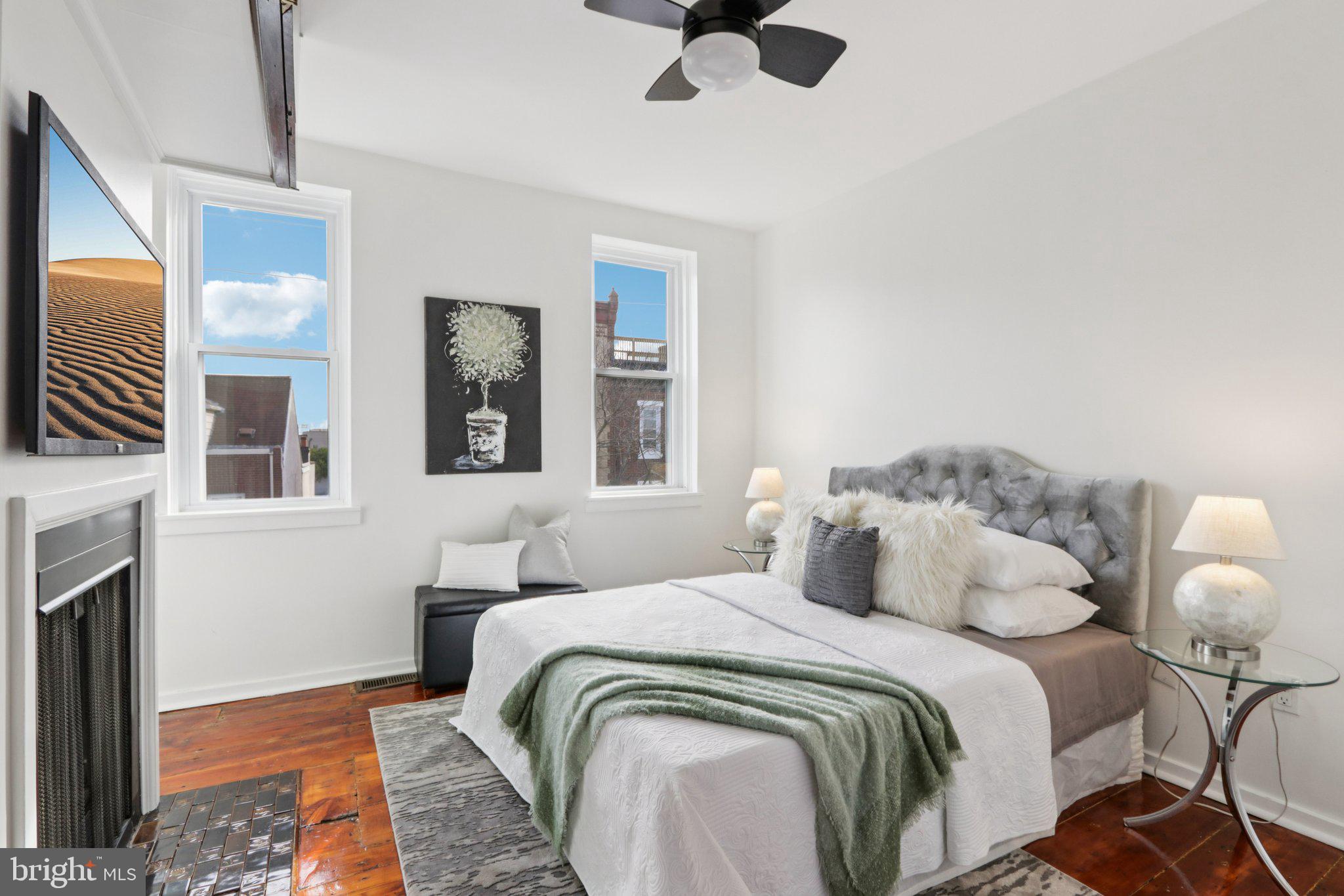 764 South Front Street Philadelphia, PA 19147 - Photo 24 of 46 a bedroom with bed and a fireplace