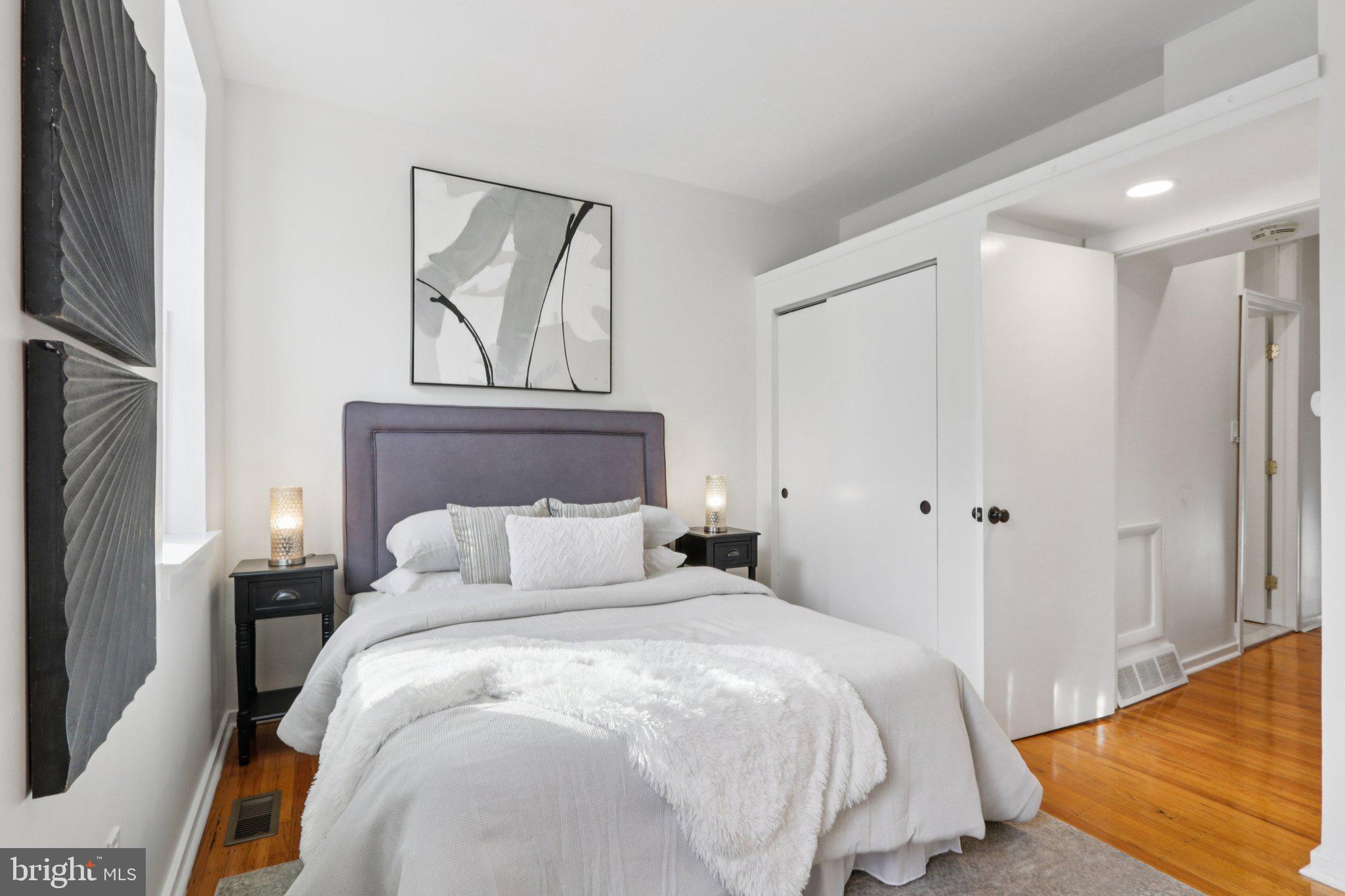 764 South Front Street Philadelphia, PA 19147 - Photo 29 of 46 a bedroom with a bed a mirror and a window