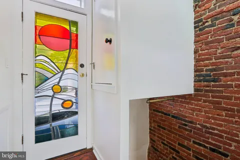 a view of a refrigerator and car parked