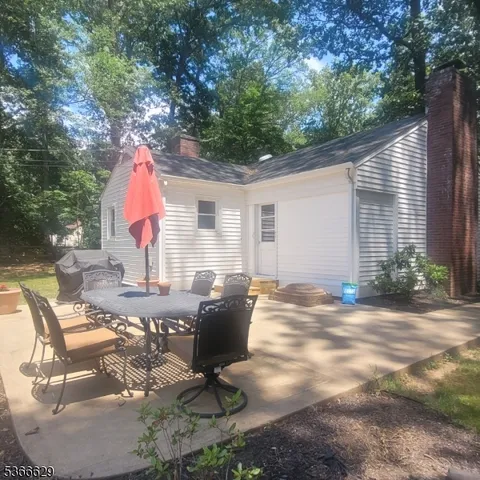 a living room with furniture a rug and a large window