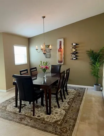 a view of a dining room with furniture