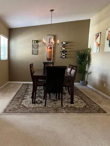 a view of a dining room with furniture