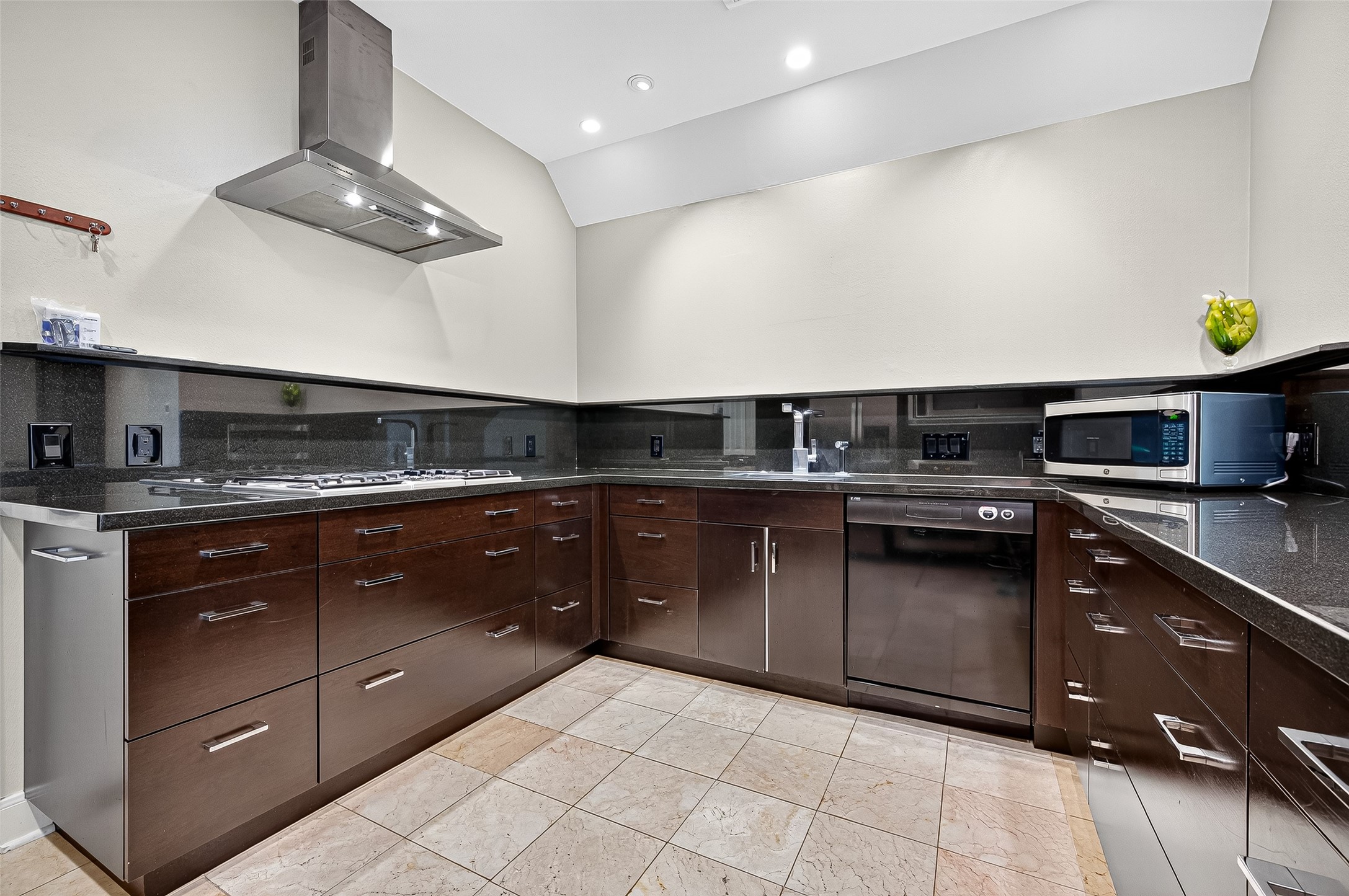 3027 Bissonnet Street Houston, TX 77005 - Photo 17 of 47 Professional range hood and generous prep space — gas cooktop ready for your next meal