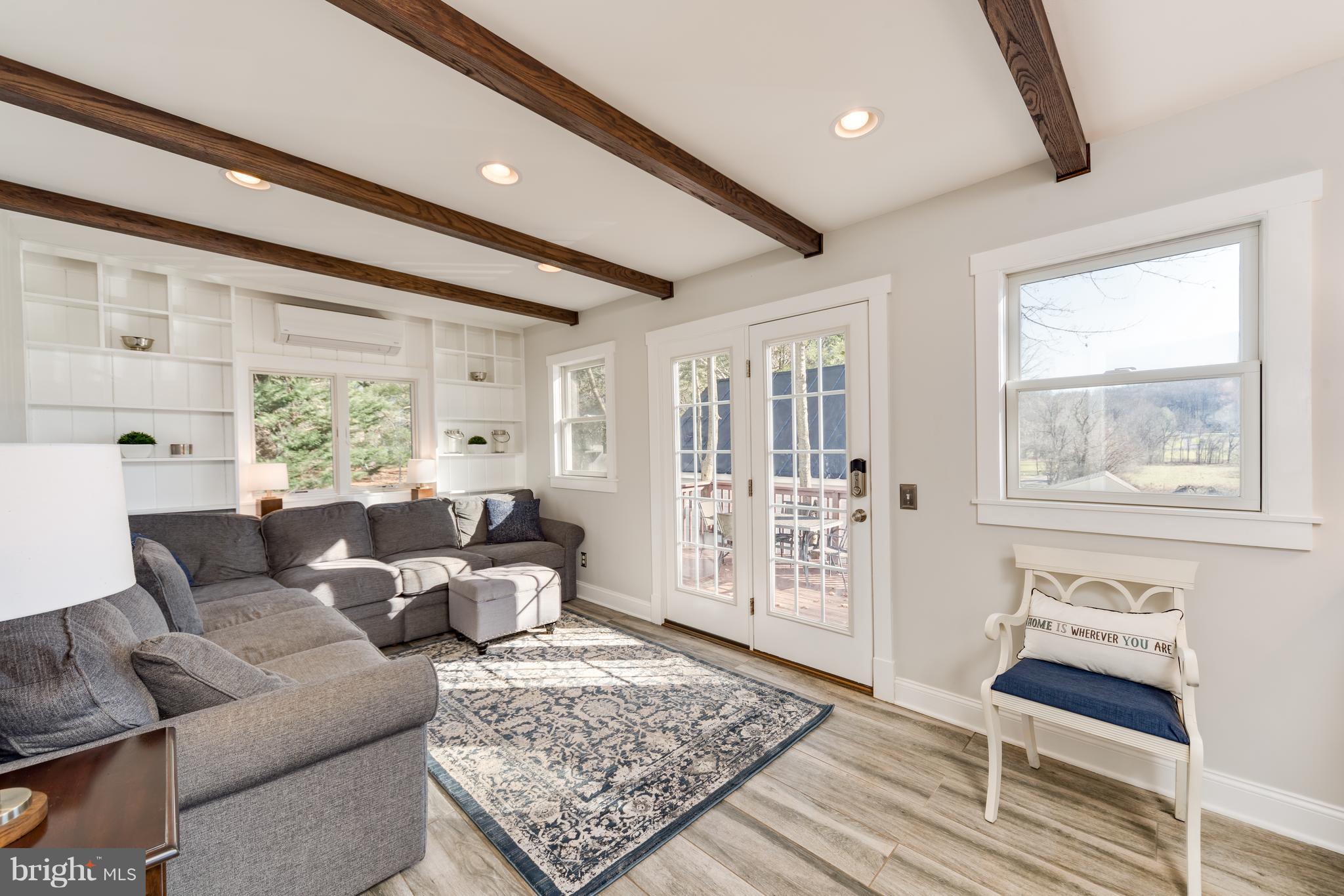 12721 Dulaney Valley Road Phoenix, MD 21131 - Photo 17 of 51 Family room leading to deck- great natural light!
