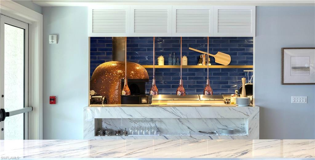 11745 Quail Village Way Naples, FL 34119 - Photo 18 of 24 Detailed view of a fire alarm and wet bar