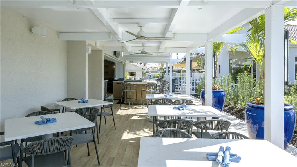 11745 Quail Village Way Naples, FL 34119 - Photo 22 of 24 View of patio / terrace with outdoor dining space and a ceiling fan