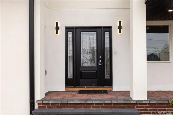 a picture of a bench in front of a wall