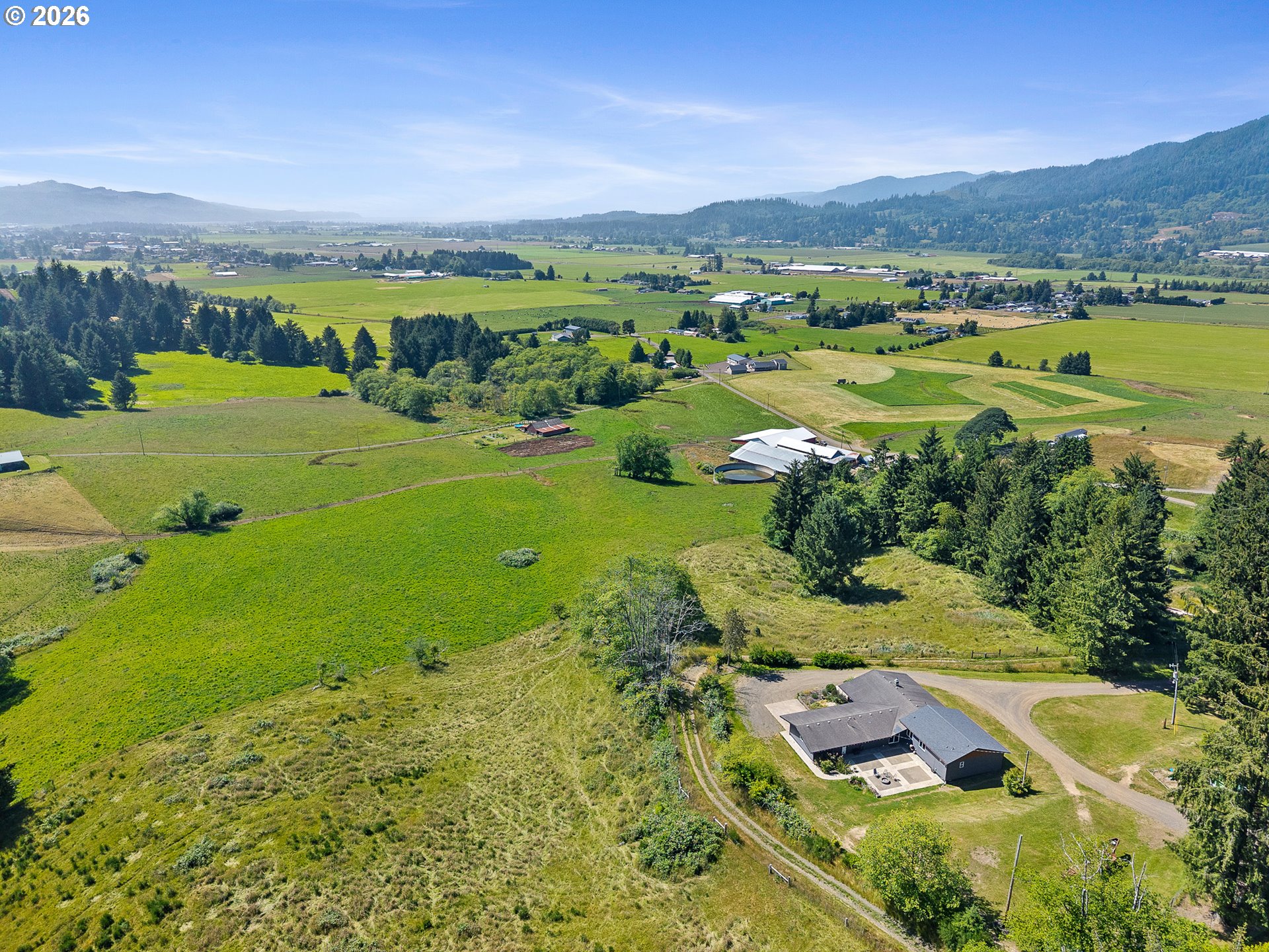 850 Hodgdon Road Tillamook, OR 97141 - Photo 2 of 43 a view of a city with mountains in the background