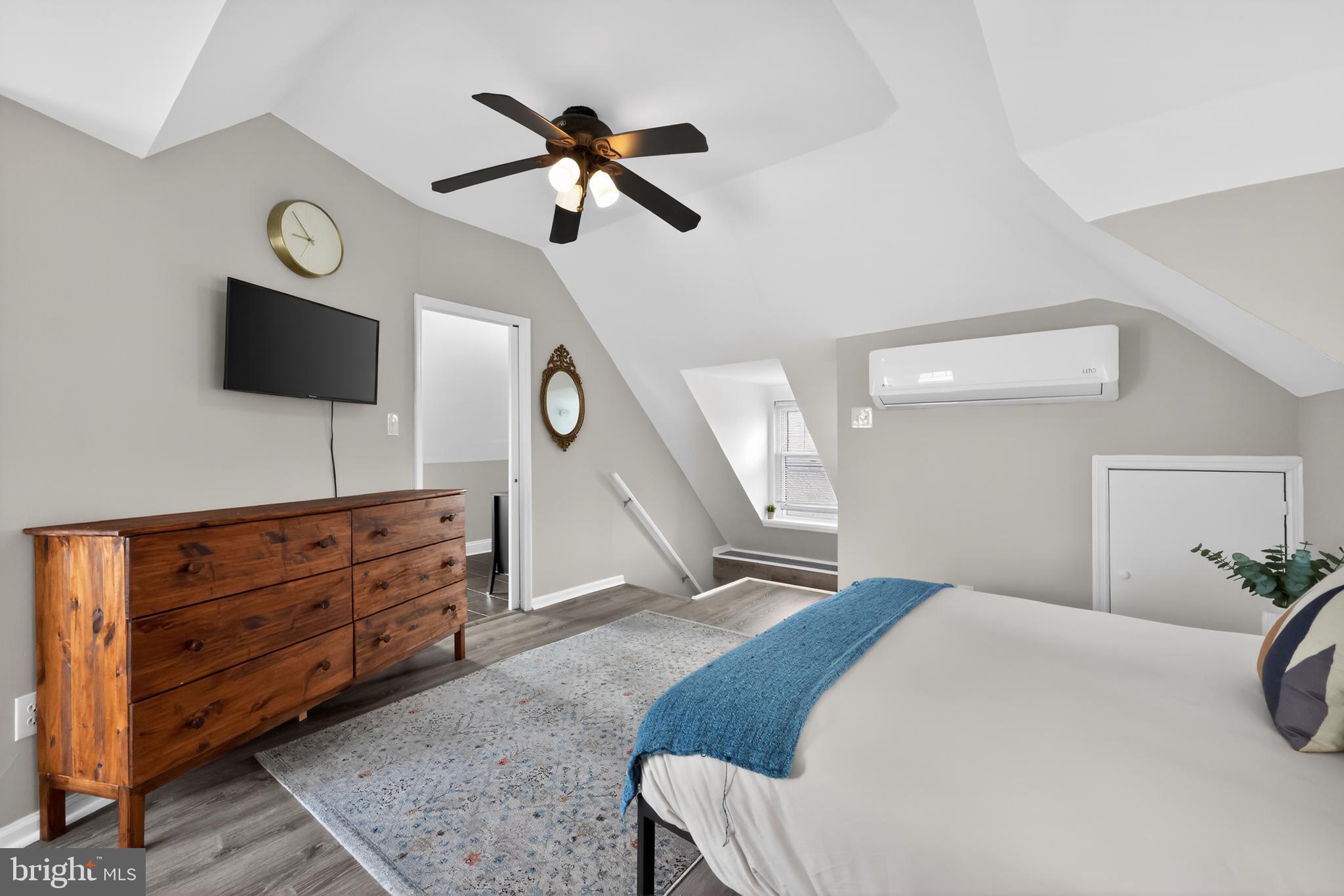208 Richey Avenue Collingswood, NJ 08107 - Photo 30 of 35 a bedroom with a bed and a flat screen tv