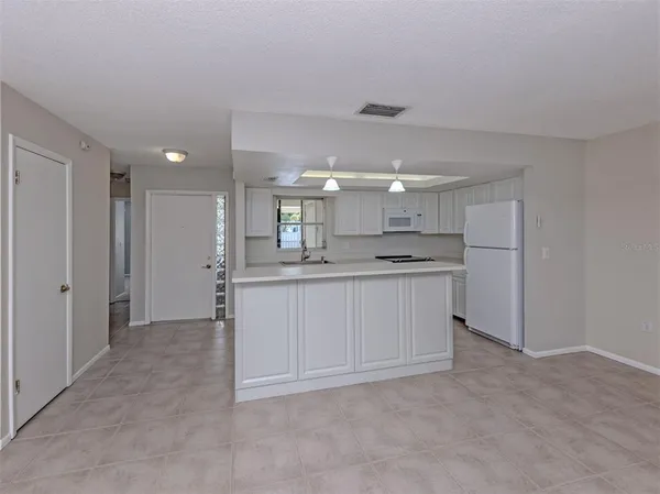 a view of kitchen cabinets and stainless steel appliances