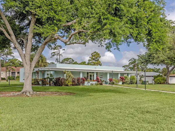 a view of a swimming pool and a lawn chairs