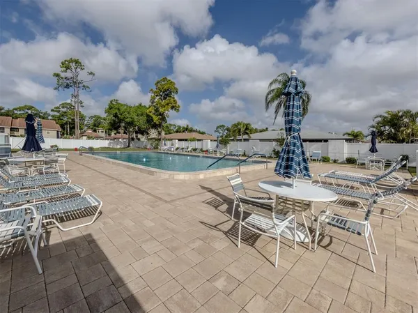 a view of a swimming pool and a yard