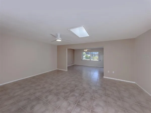 a view of an empty room with a window