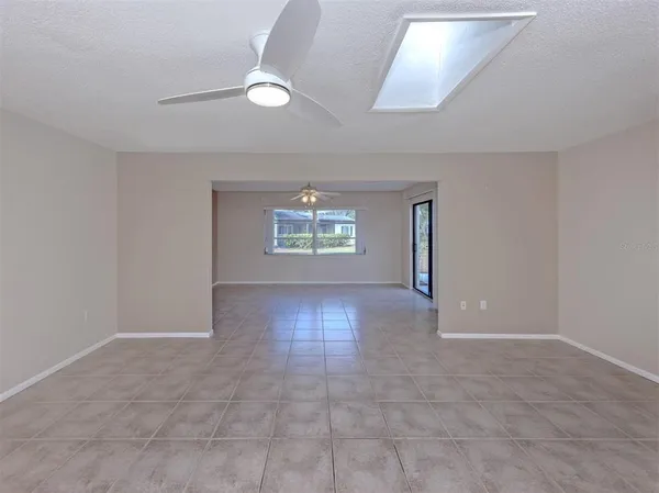 an empty room with windows and entrance