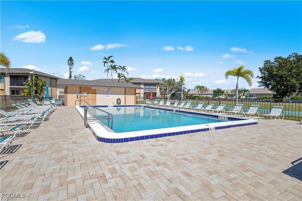 16881 Davis Road, Unit 414 Fort Myers, FL 33908 - Photo 16 of 24 a view of a swimming pool and outdoor space