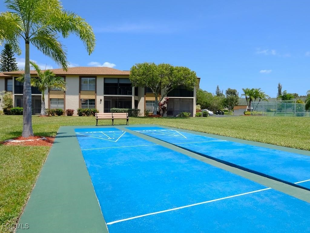 16881 Davis Road, Unit 414 Fort Myers, FL 33908 - Photo 19 of 24 a view of a house with a big yard