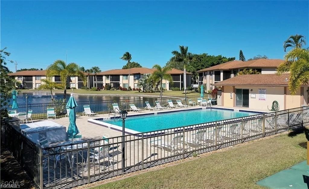16881 Davis Road, Unit 414 Fort Myers, FL 33908 - Photo 21 of 24 a front view of a house with garden