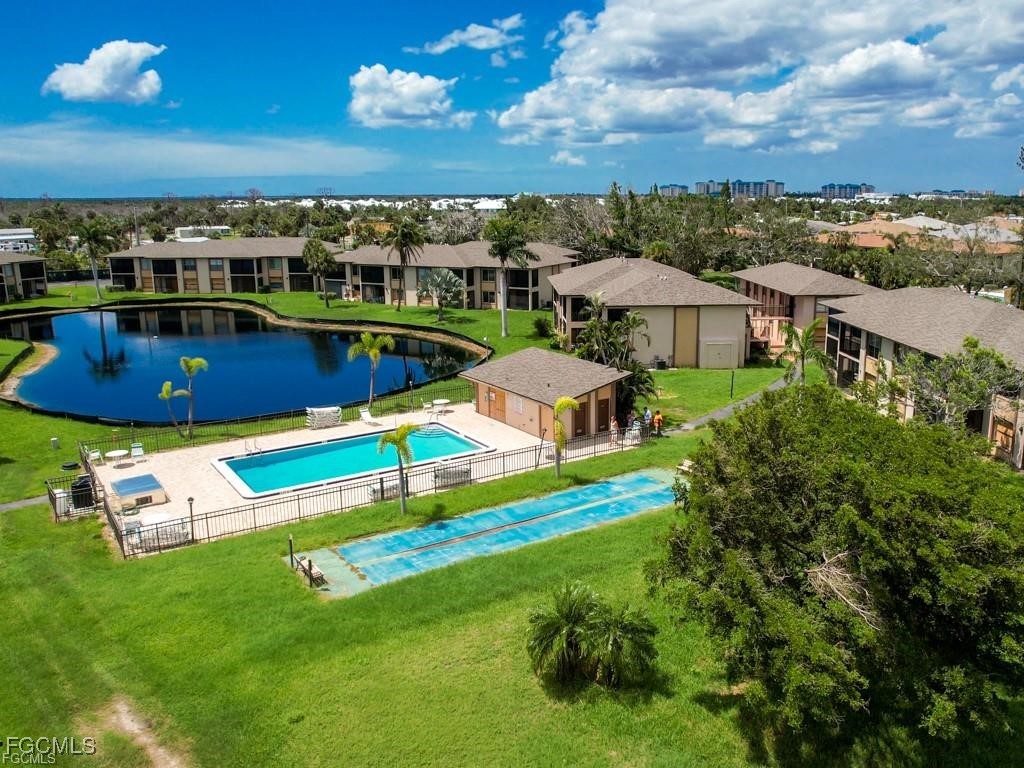 16881 Davis Road, Unit 414 Fort Myers, FL 33908 - Photo 4 of 24 an aerial view of a house with a big yard