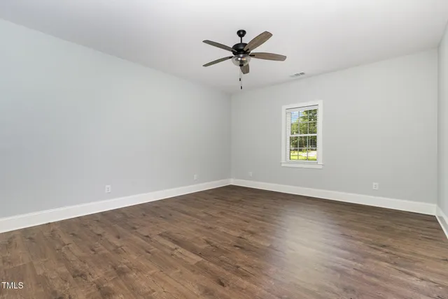 a bathroom with a double vanity sink and mirror