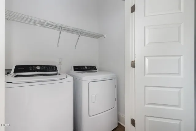 a bathroom with a toilet a sink a mirror and a bathtub