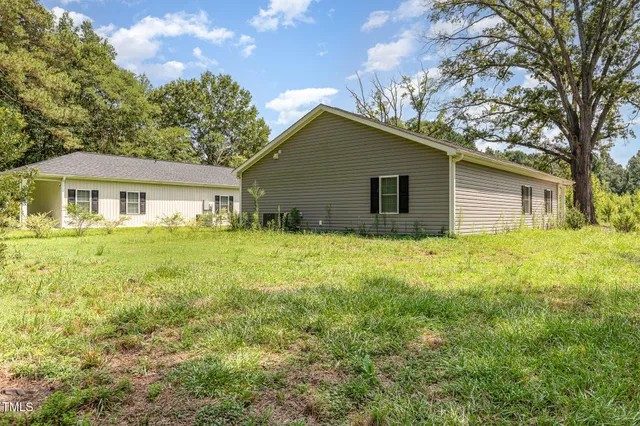a backyard of a house with lots of green space