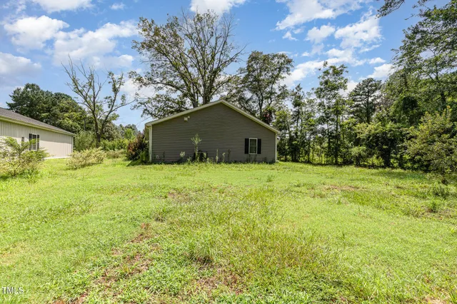 a house with trees in the background