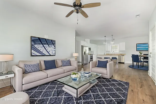 a view of empty room with wooden floor and window