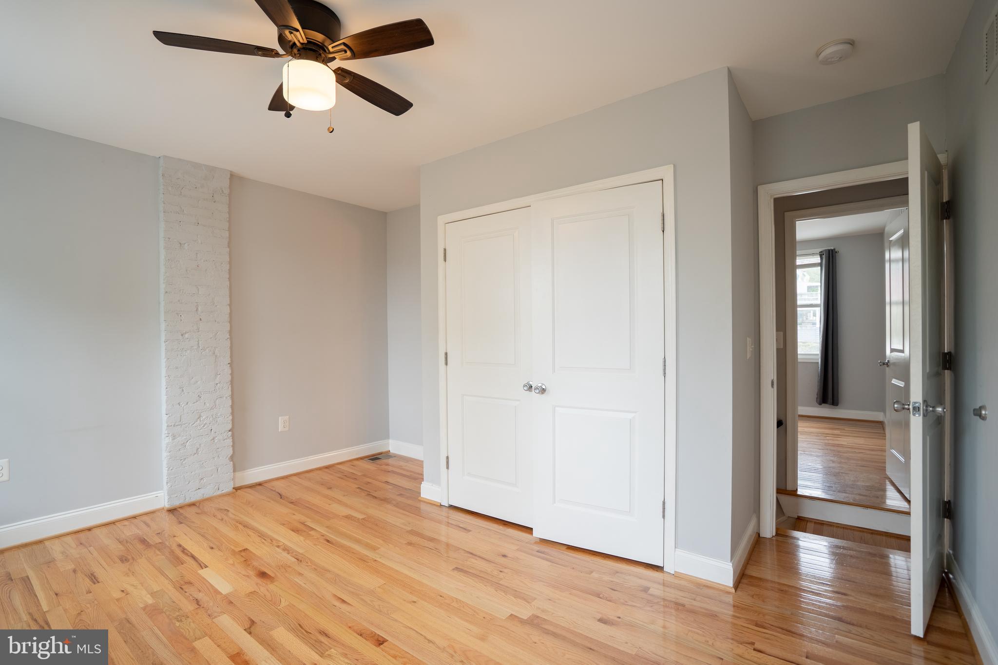 3804 Falls Road Baltimore, MD 21211 - Photo 7 of 18 a view of empty room with wooden floor