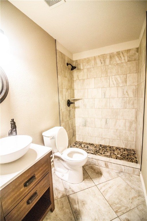 413 Moorhen Cove Leander, TX 78641 - Photo 11 of 18 a bathroom with a sink toilet and shower