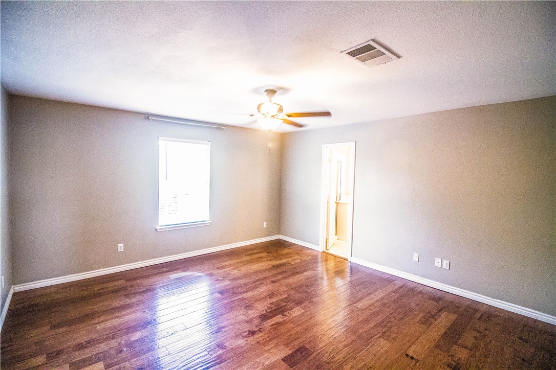 413 Moorhen Cove Leander, TX 78641 - Photo 14 of 18 a view of a livingroom with a window and wooden floor