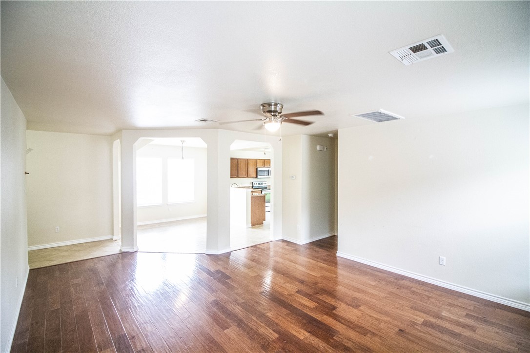 413 Moorhen Cove Leander, TX 78641 - Photo 6 of 18 a view of a room with wooden floor