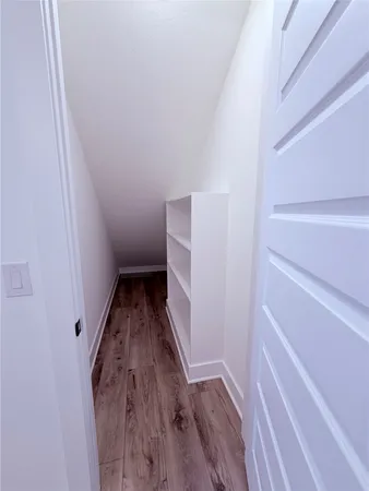 a view of entryway with wooden floor