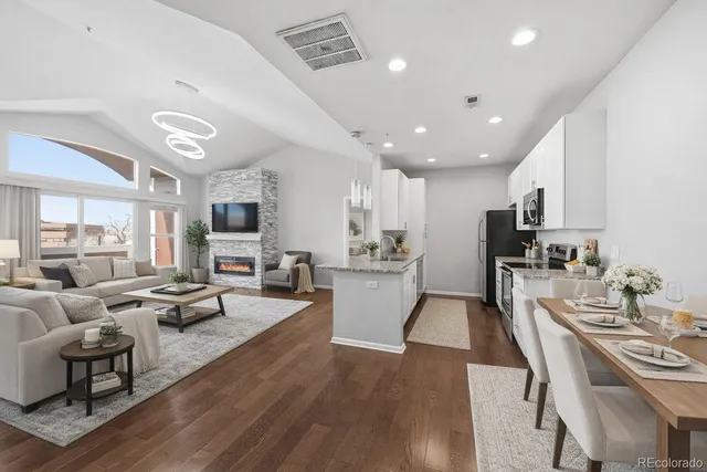 a view of kitchen with stainless steel appliances granite countertop lots of counter top space