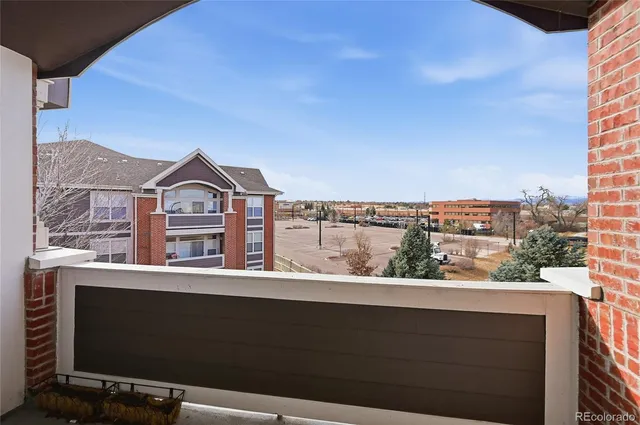 a view of a lake with houses in the back