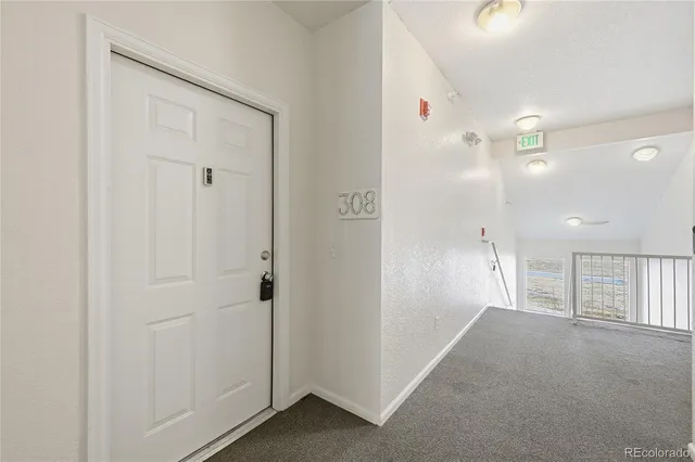 a view of a hallway with closet area