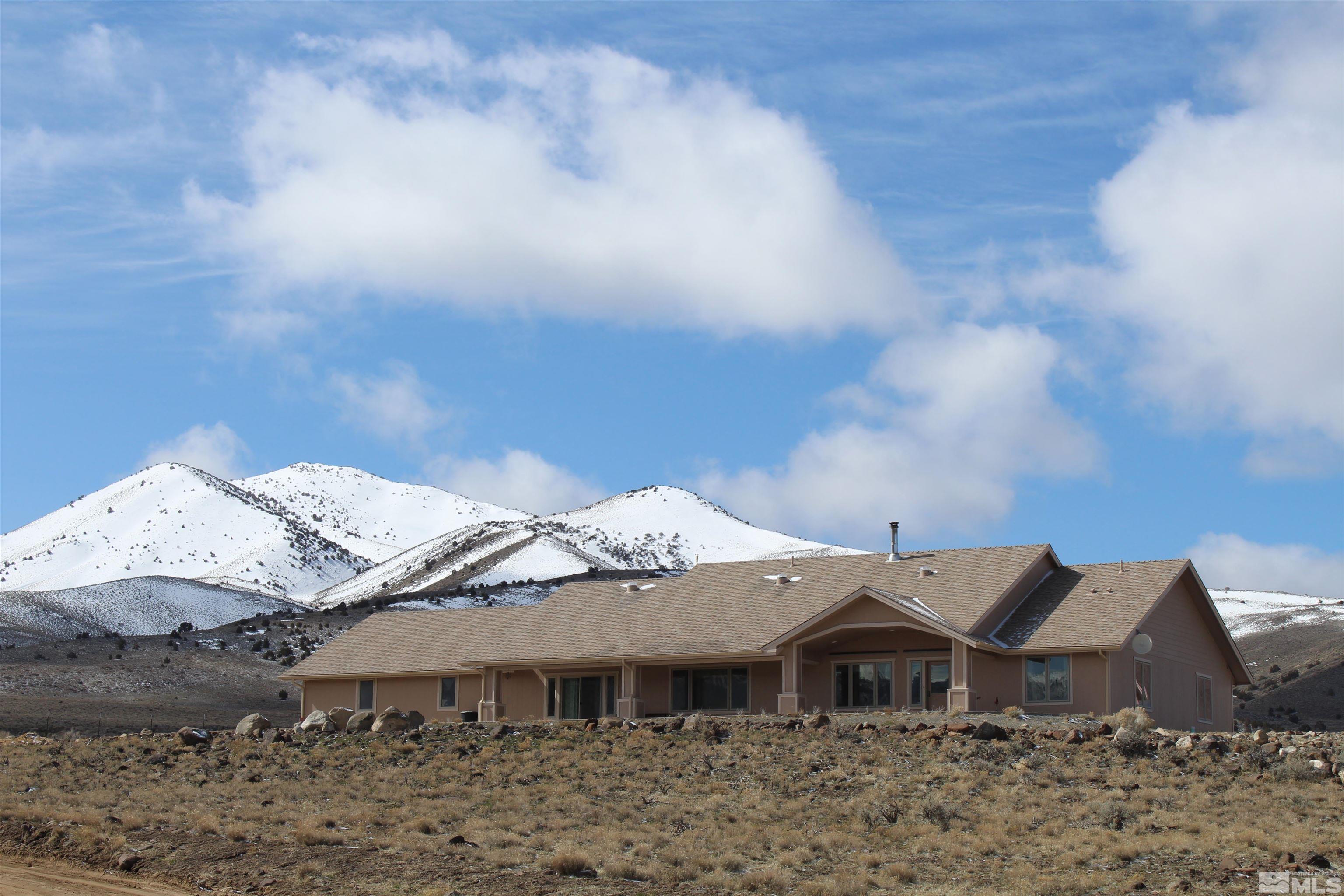 3355 Basque Oven Road Reno, NV 89510 - Photo 1 of 40 a backyard of a house with large trees