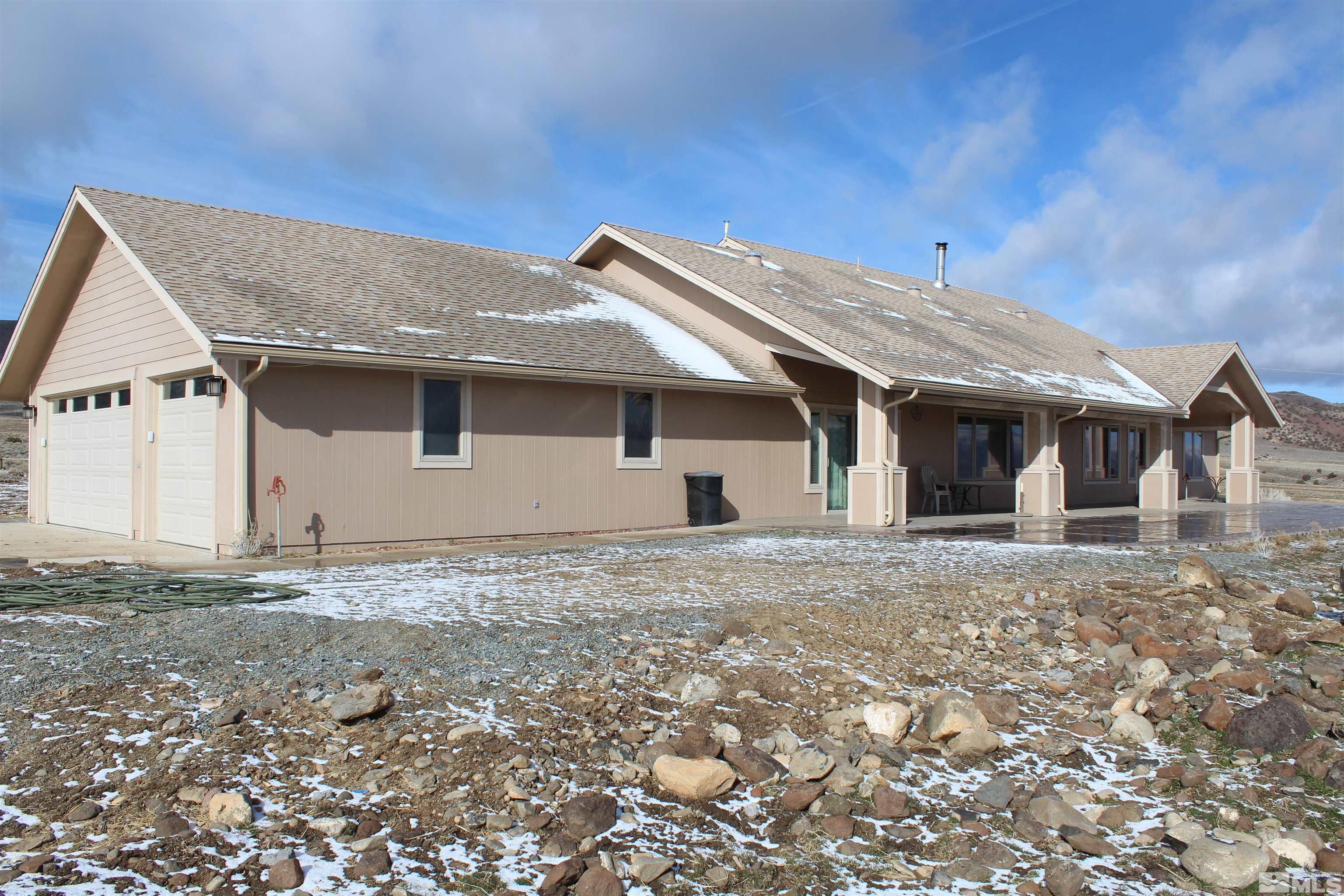 3355 Basque Oven Road Reno, NV 89510 - Photo 3 of 40 a front view of a house with a garden