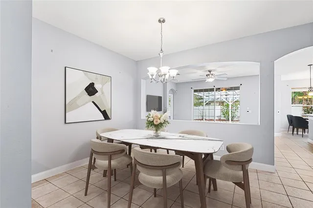 a view of a dining room with furniture and window