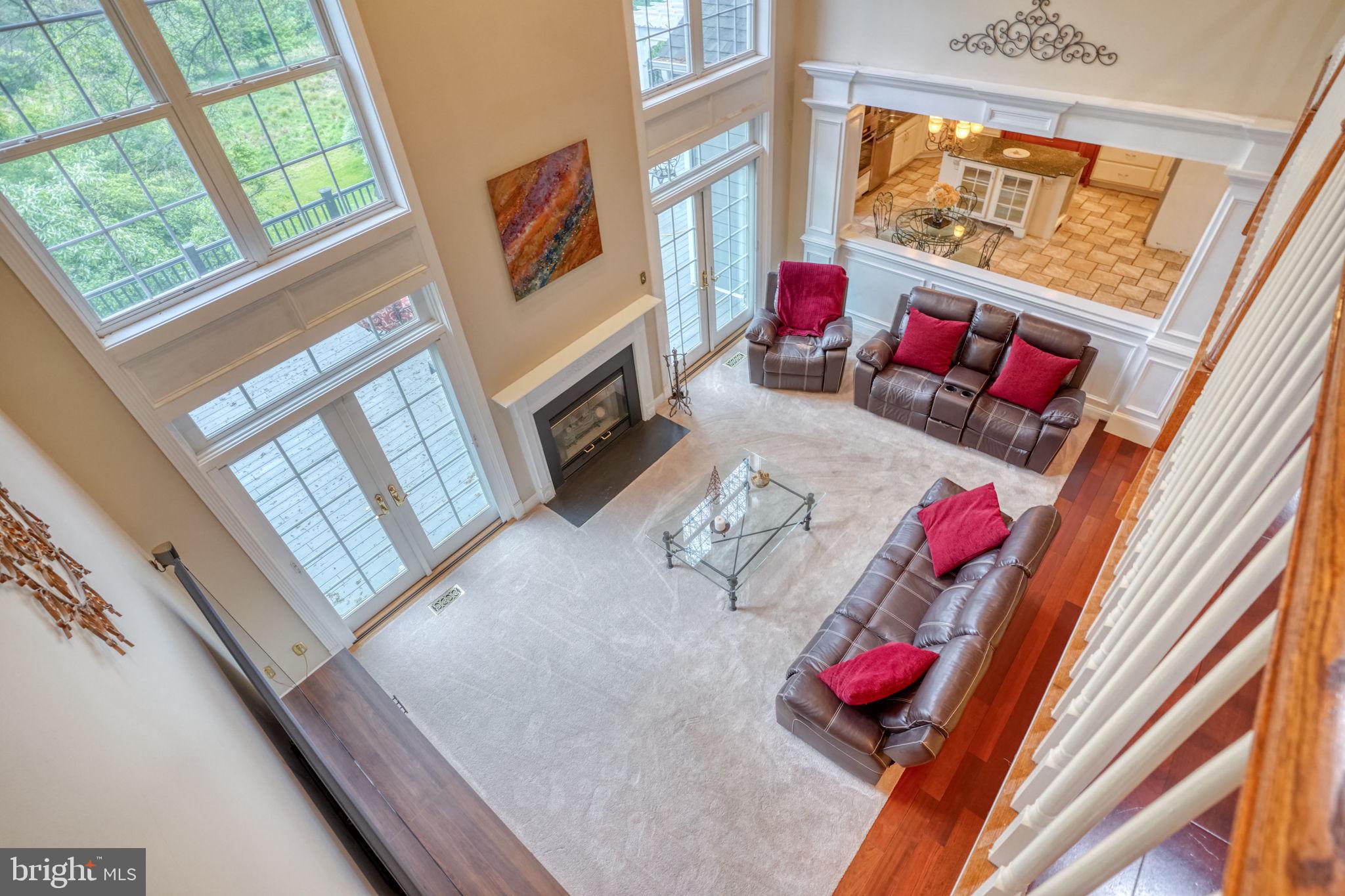 357 Willits Way Garnet Valley, PA 19060 - Photo 32 of 63 a living room with furniture and a floor to ceiling window
