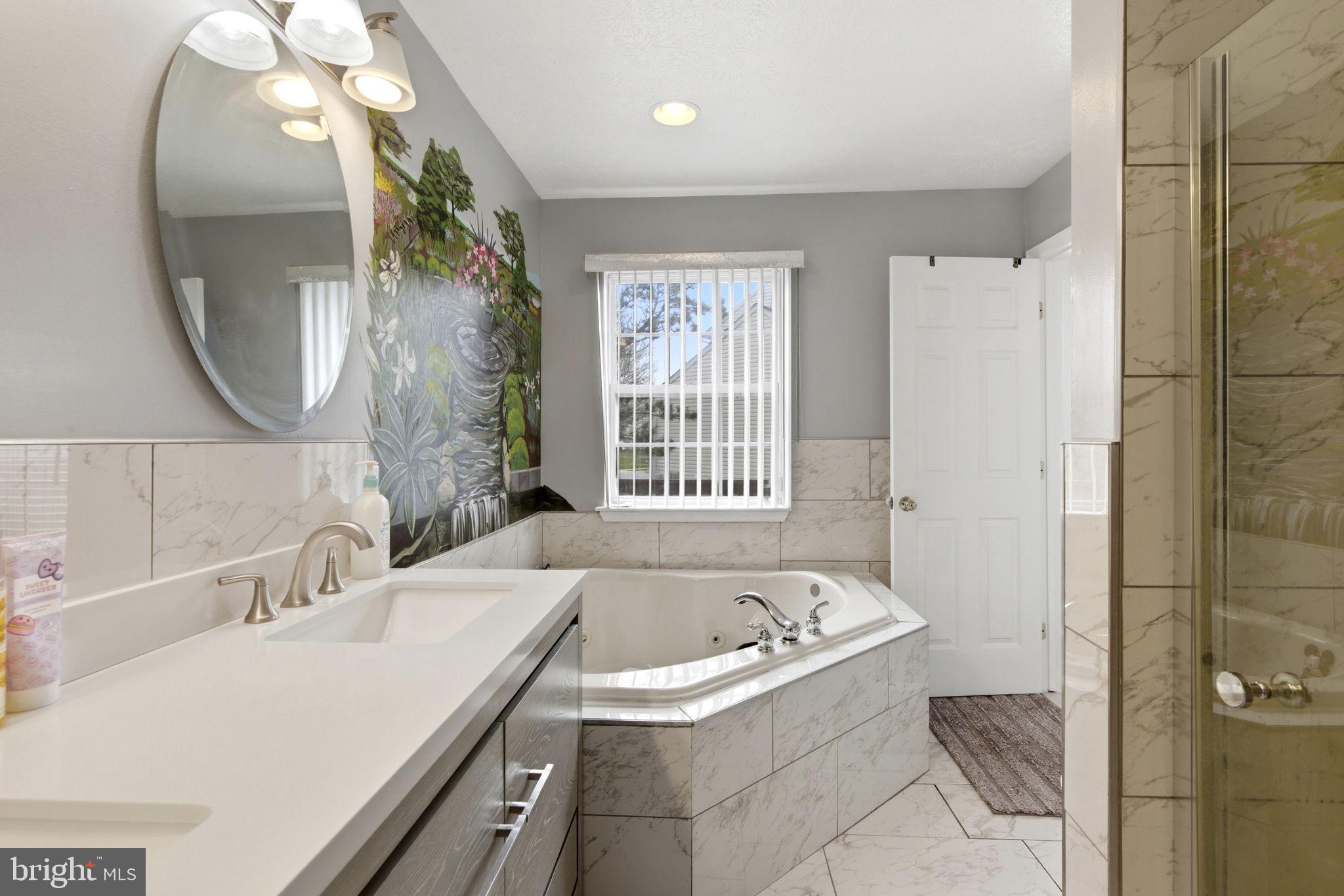 3413 Barkley Woods Road Baltimore, MD 21244 - Photo 12 of 31 a bathroom with a sink and a mirror