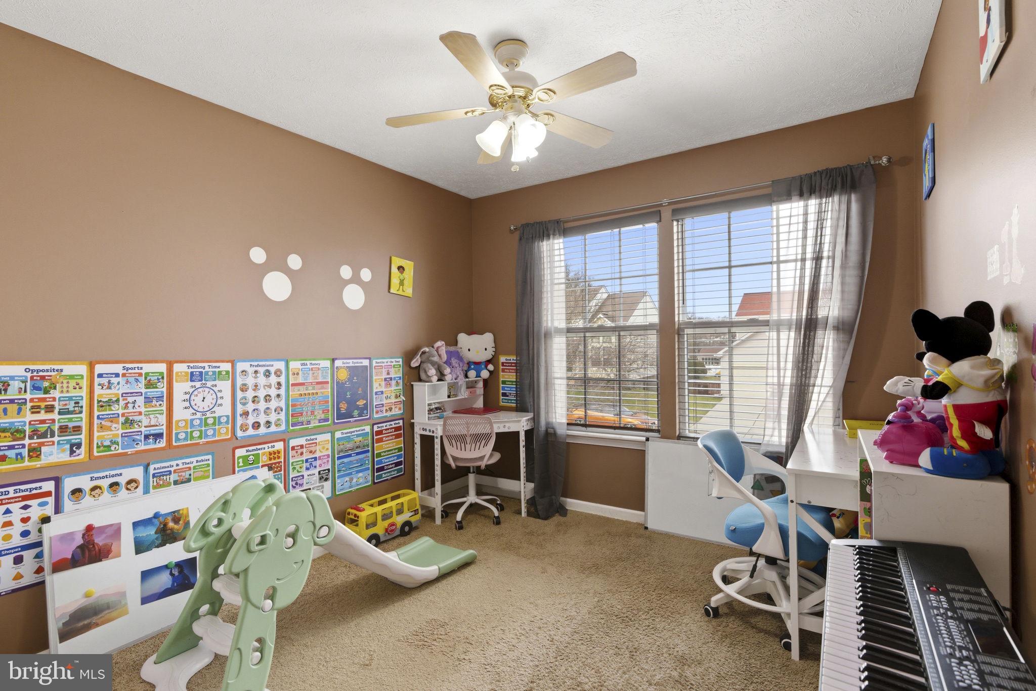 3413 Barkley Woods Road Baltimore, MD 21244 - Photo 13 of 31 a living room with furniture and a floor to ceiling window