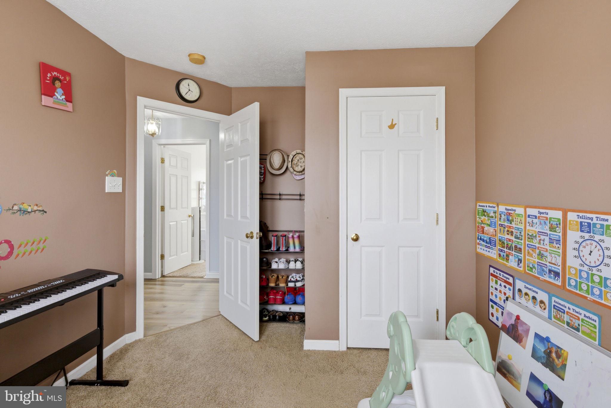 3413 Barkley Woods Road Baltimore, MD 21244 - Photo 14 of 31 a living room with furniture and a window