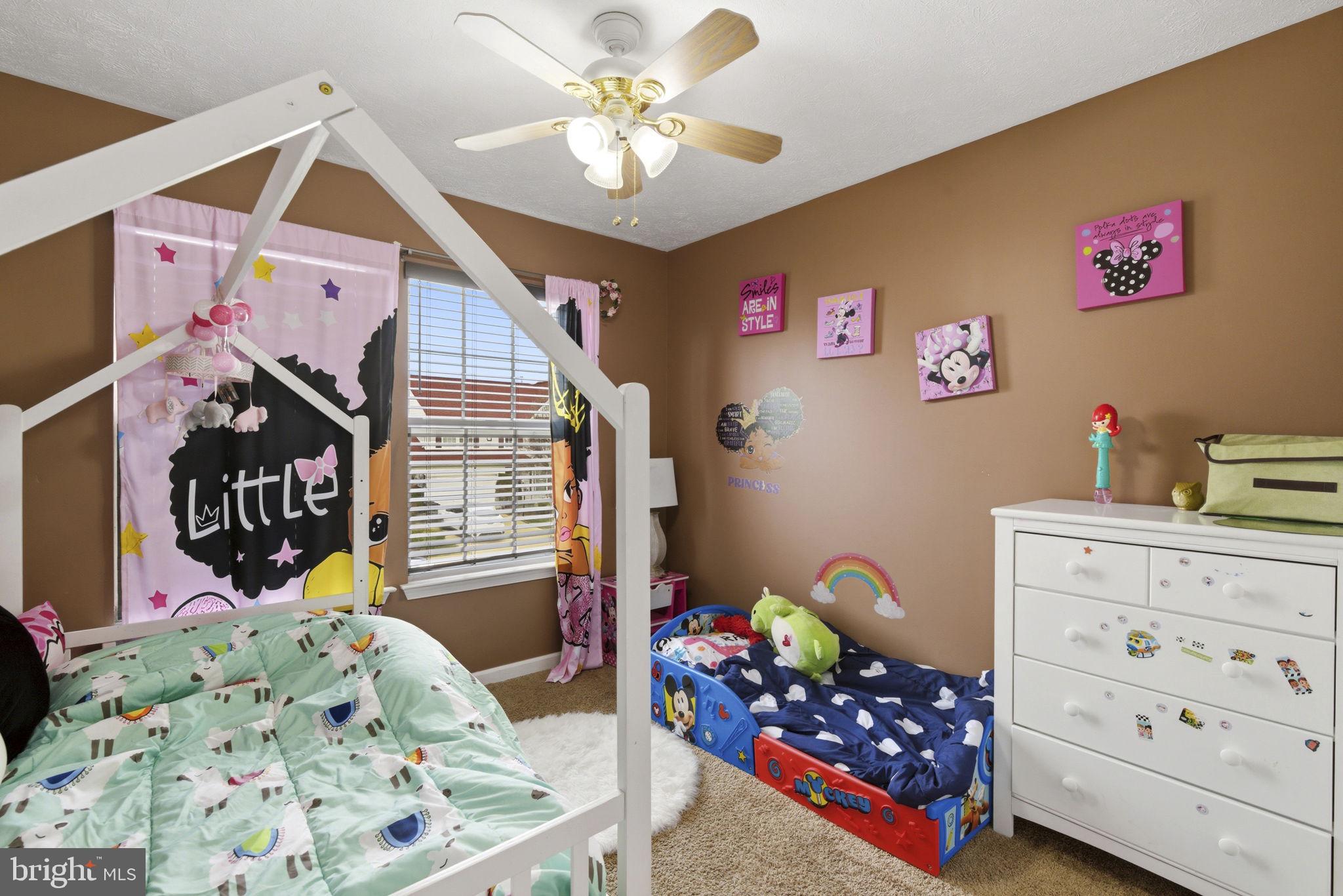 3413 Barkley Woods Road Baltimore, MD 21244 - Photo 15 of 31 a bedroom with furniture and a baby crib