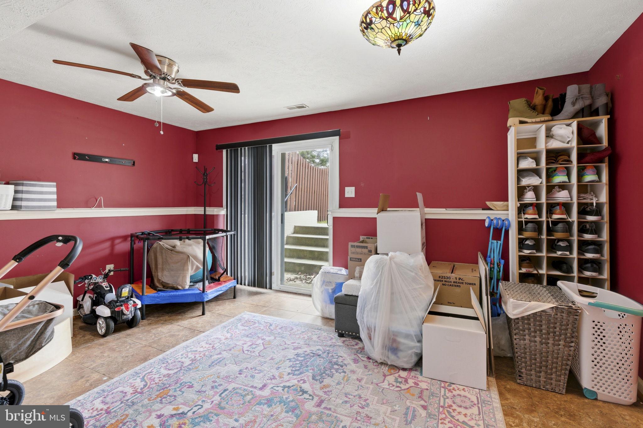 3413 Barkley Woods Road Baltimore, MD 21244 - Photo 17 of 31 a bedroom with furniture and a chandelier