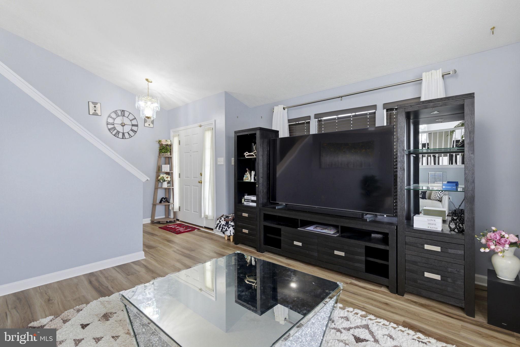 3413 Barkley Woods Road Baltimore, MD 21244 - Photo 2 of 31 a room with furniture and flat screen tv