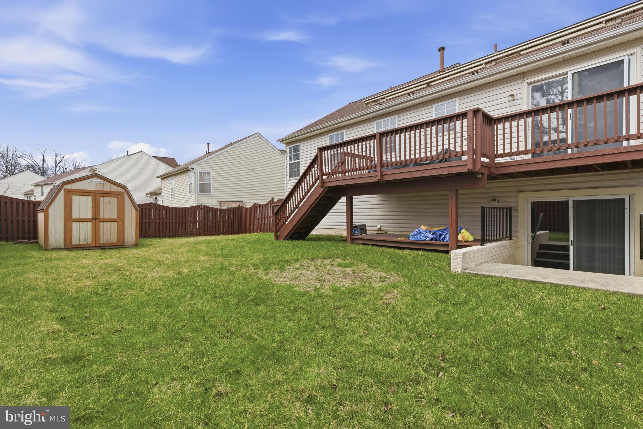3413 Barkley Woods Road Baltimore, MD 21244 - Photo 22 of 31 a view of a house with a backyard