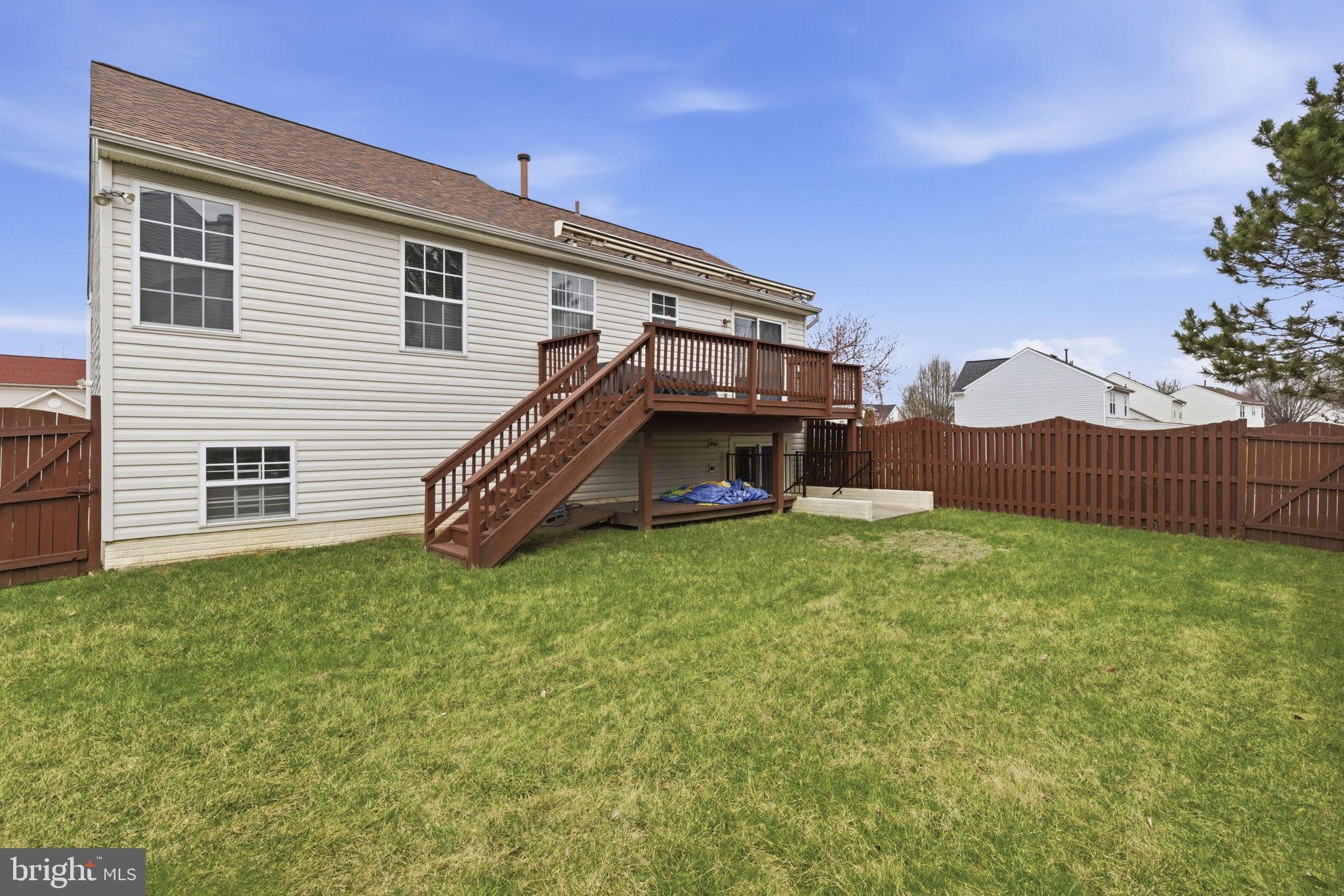 3413 Barkley Woods Road Baltimore, MD 21244 - Photo 23 of 31 a view of backyard with a garden and deck
