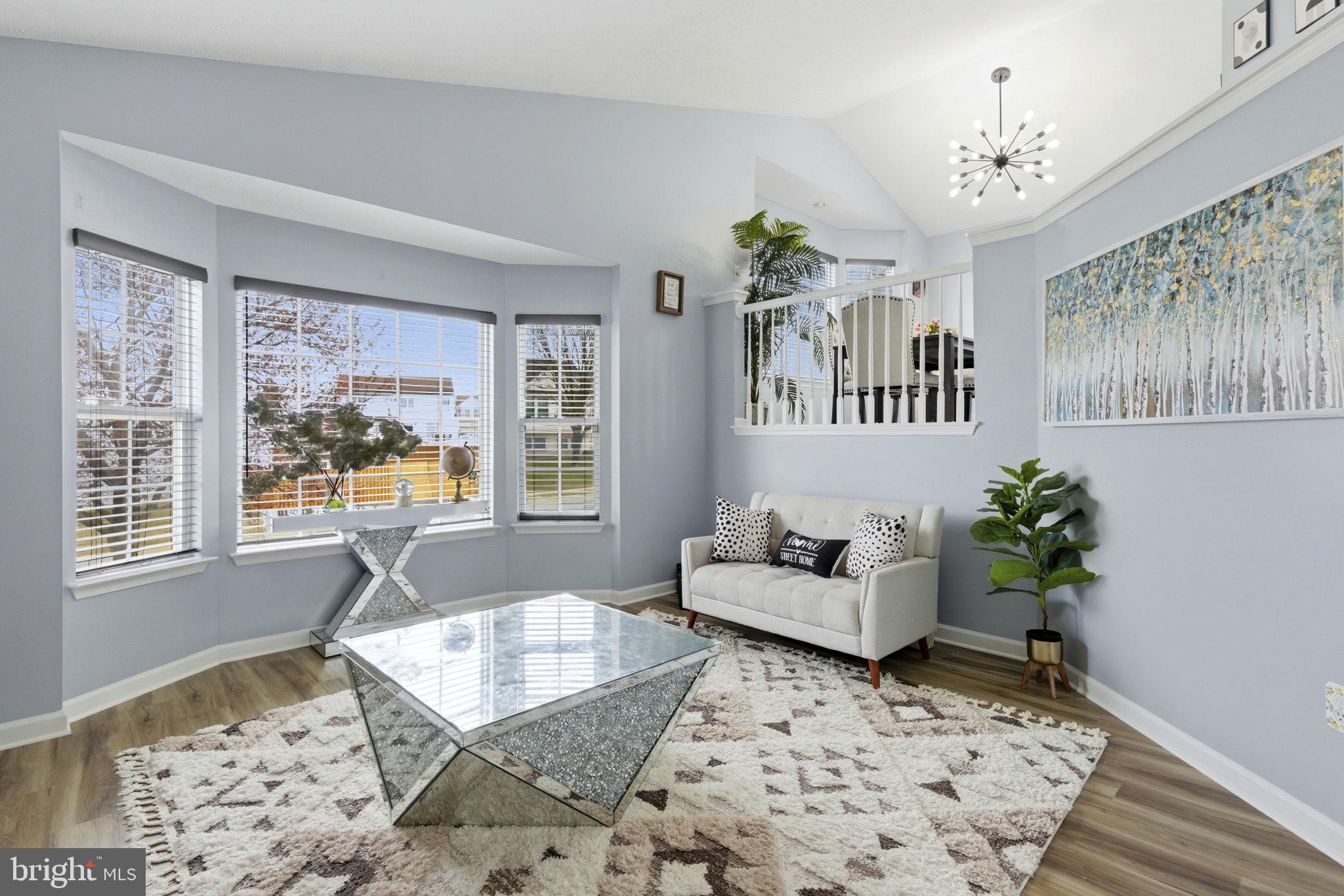 3413 Barkley Woods Road Baltimore, MD 21244 - Photo 3 of 31 a living room with furniture and a window