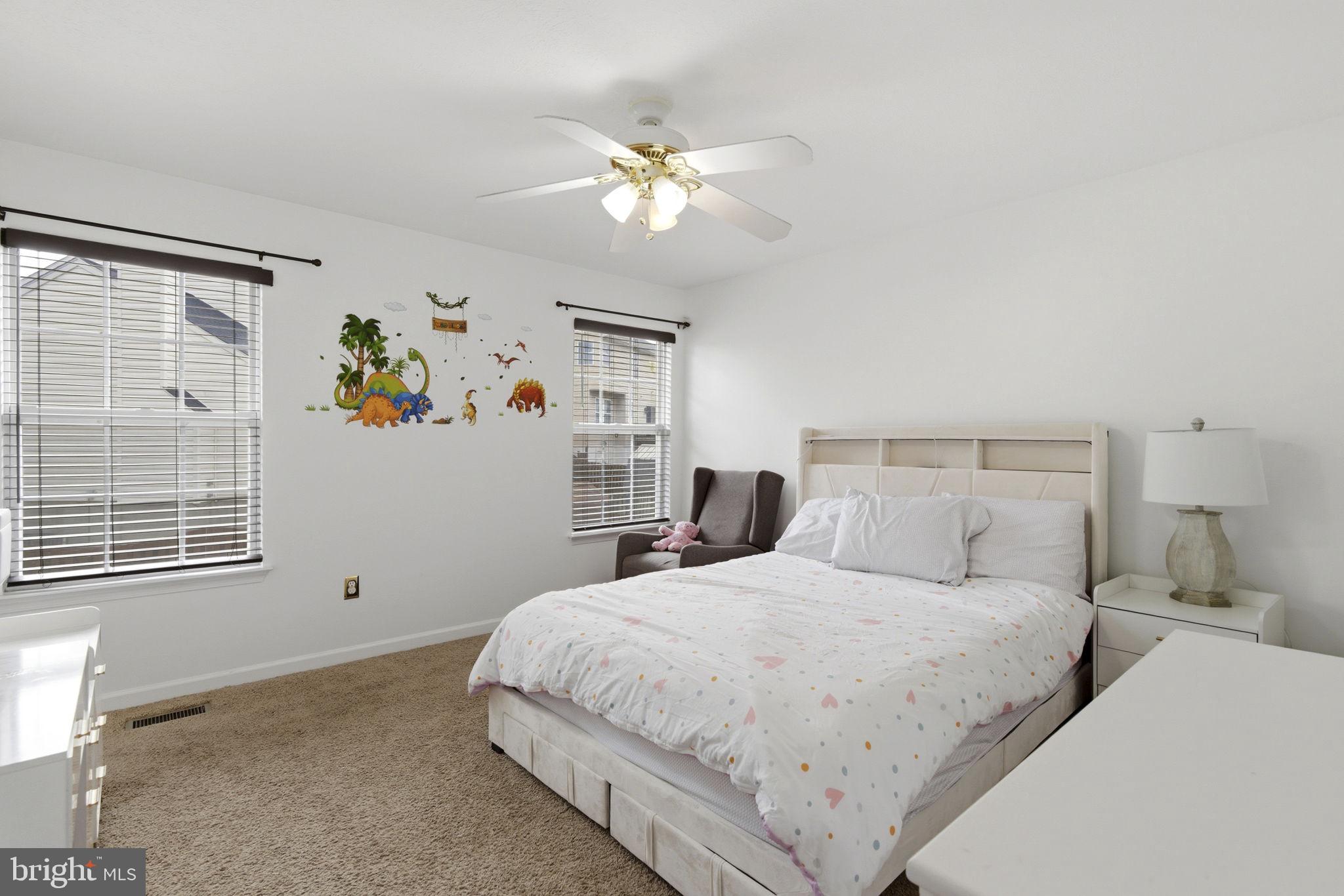 3413 Barkley Woods Road Baltimore, MD 21244 - Photo 8 of 31 a bedroom with a bed and a window